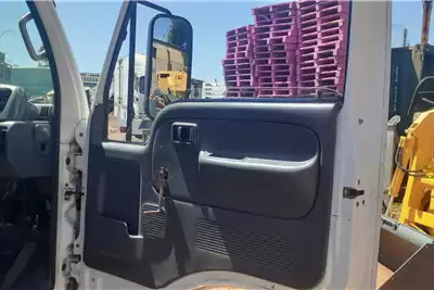 Nissan Dropside trucks Nissan UD35 Dropside with mesh 2010 for sale by D and O truck and plant | Truck & Trailer Marketplace