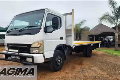 Fuso Flatbed trucks Canter FE7 136 Flat Deck 2010 for sale by Kagima Earthmoving | Truck & Trailer Marketplace