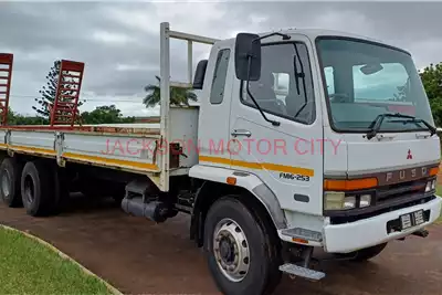 Fuso Dropside trucks FM16.253 TAG AXLE DROPSIDE WITH BEAVERTAIL 2010 for sale by Jackson Motor City | Truck & Trailer Marketplace